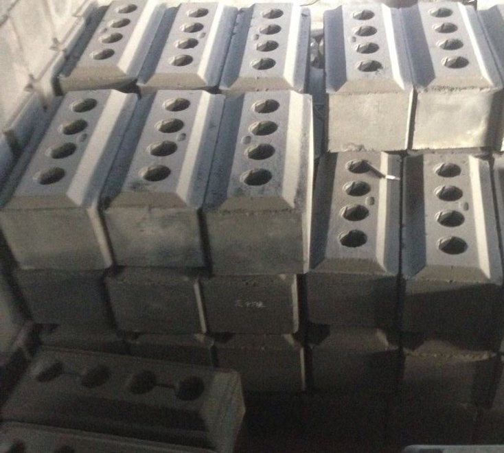 Processo di produzione del blocco di carbone anodico precotto